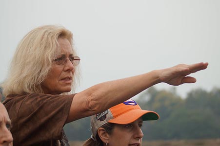 Tour guide on safari pointing 