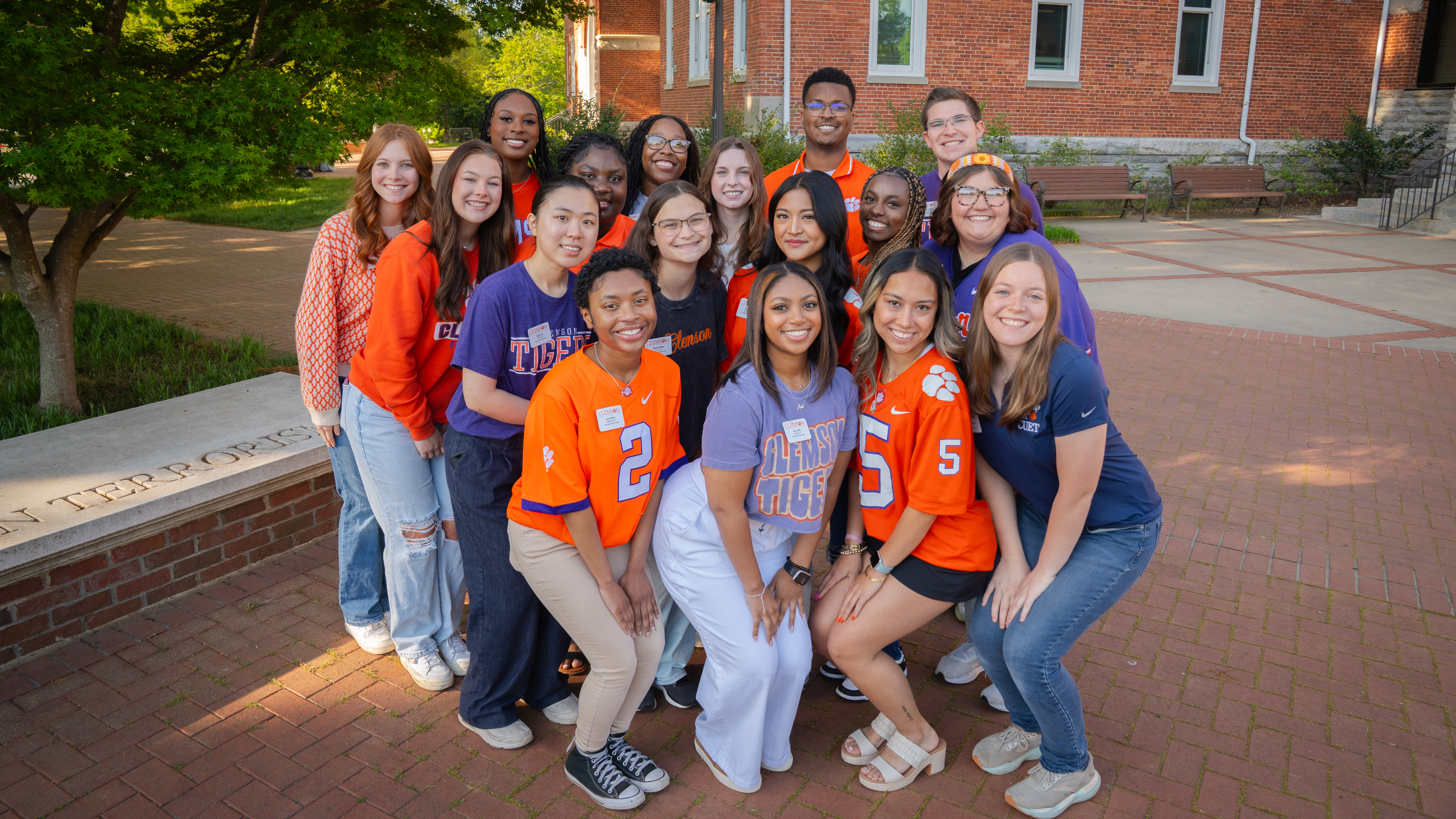 group shot of orientation ambassadors on side of Tillman Hall