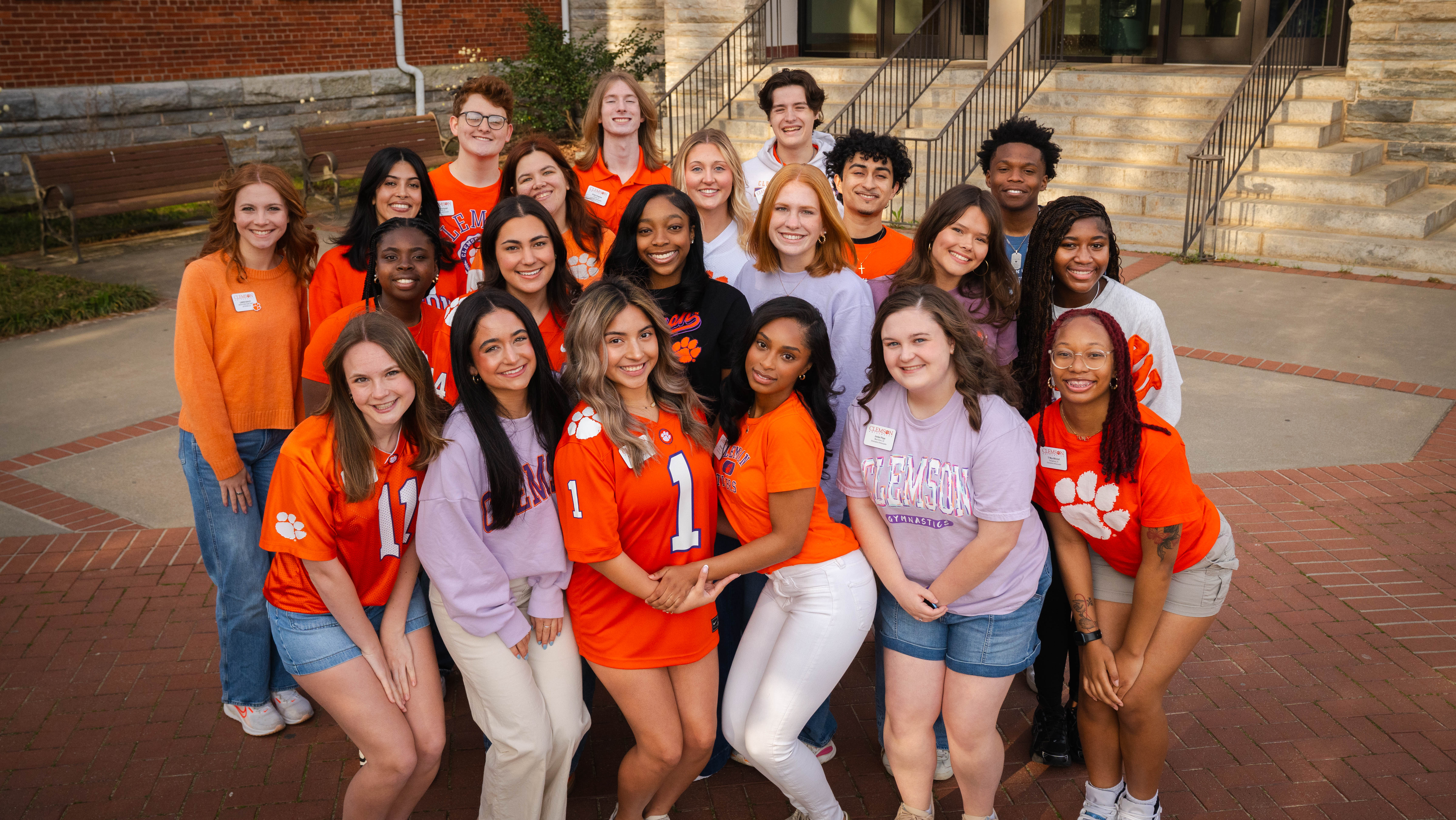 group shot of orientation ambassadors on side of Tillman Hall