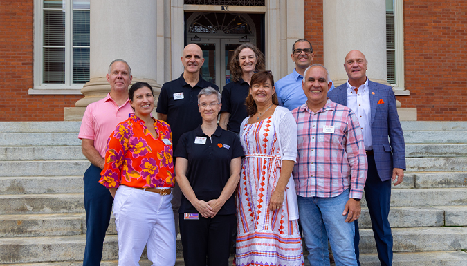 Clemson PCVM faculty standing in front of the Sikes Hall with President Clements.
