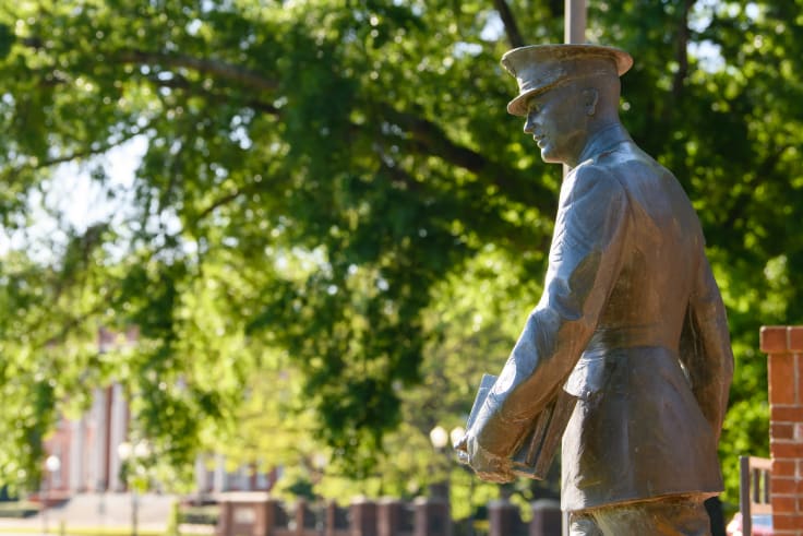 A statue of a solider in Cox memorial plaza