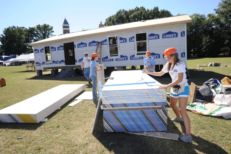 Students help build a habitat for humanity home on Bowman during homecoming