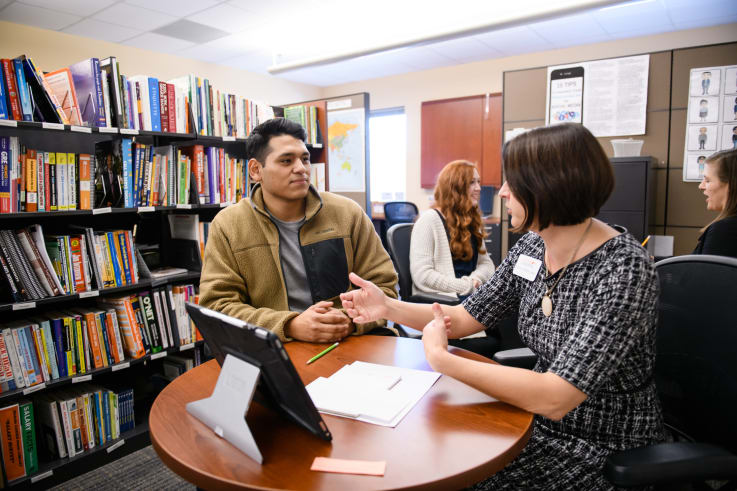 A career advisor advises a student in the center for career and professional development.