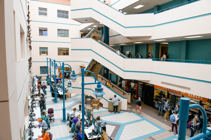 Students walking during change of class in the Brackett Hall Lobby