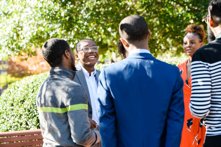 Clemson students gather and talk on campus.