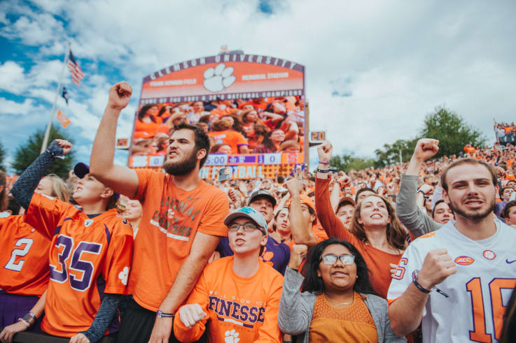 The packed student section of memorial stadium cheers on the tigers during a game