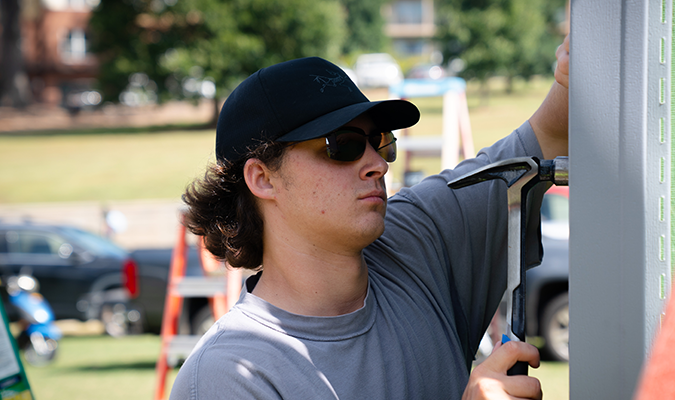 Clemson student building House for Humanity, a Clemson Homecoming Tradition, Clemson University, South Carolina