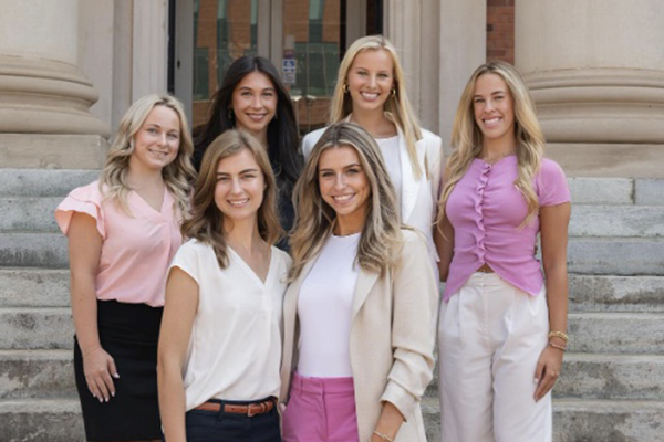 Cadency group undergraduate students standing on the steps of Sikes Hall